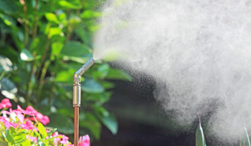 Misting system spraying service treatments